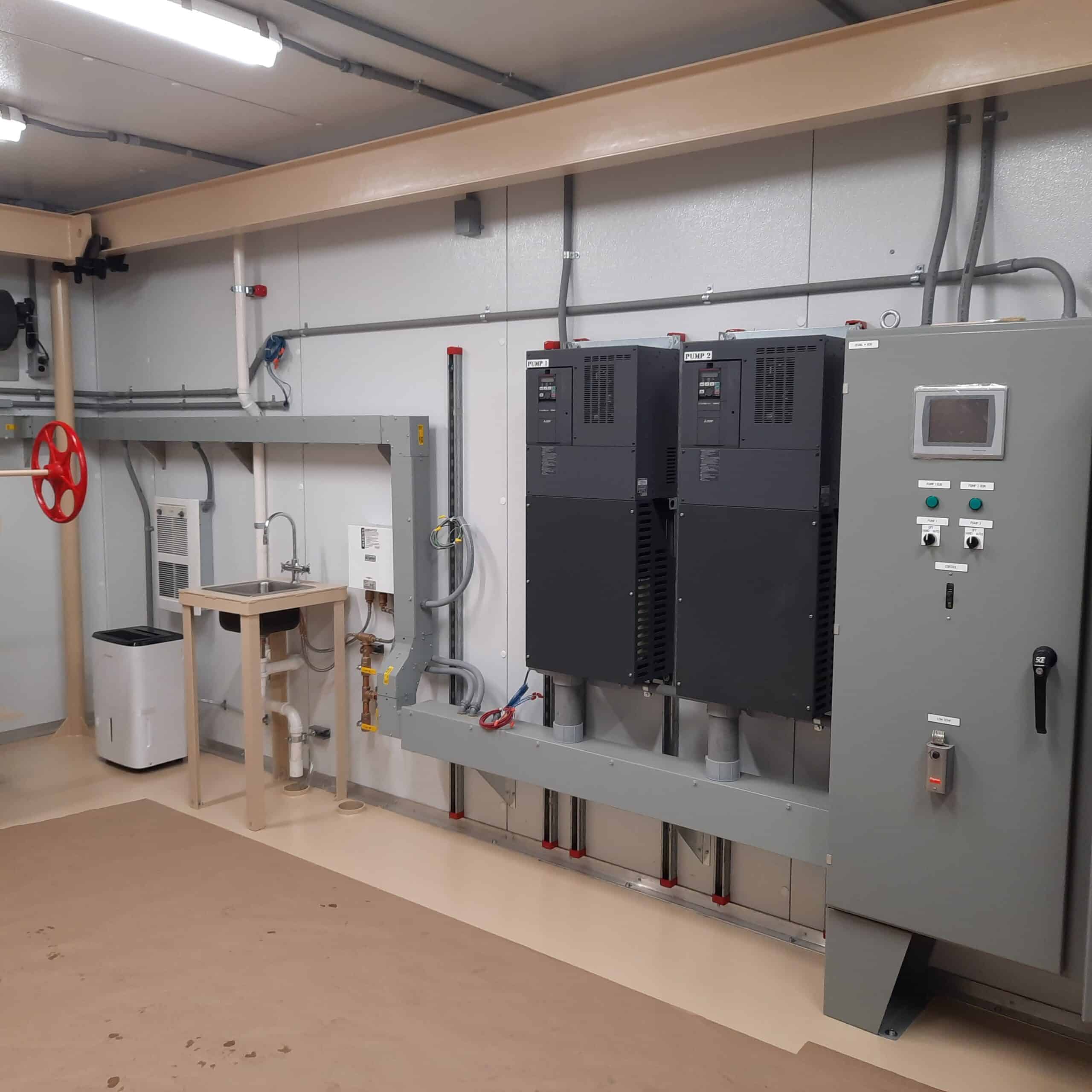Interior of Walk-In Inside of Walk-In PumpMate. Shows control panels and sink.