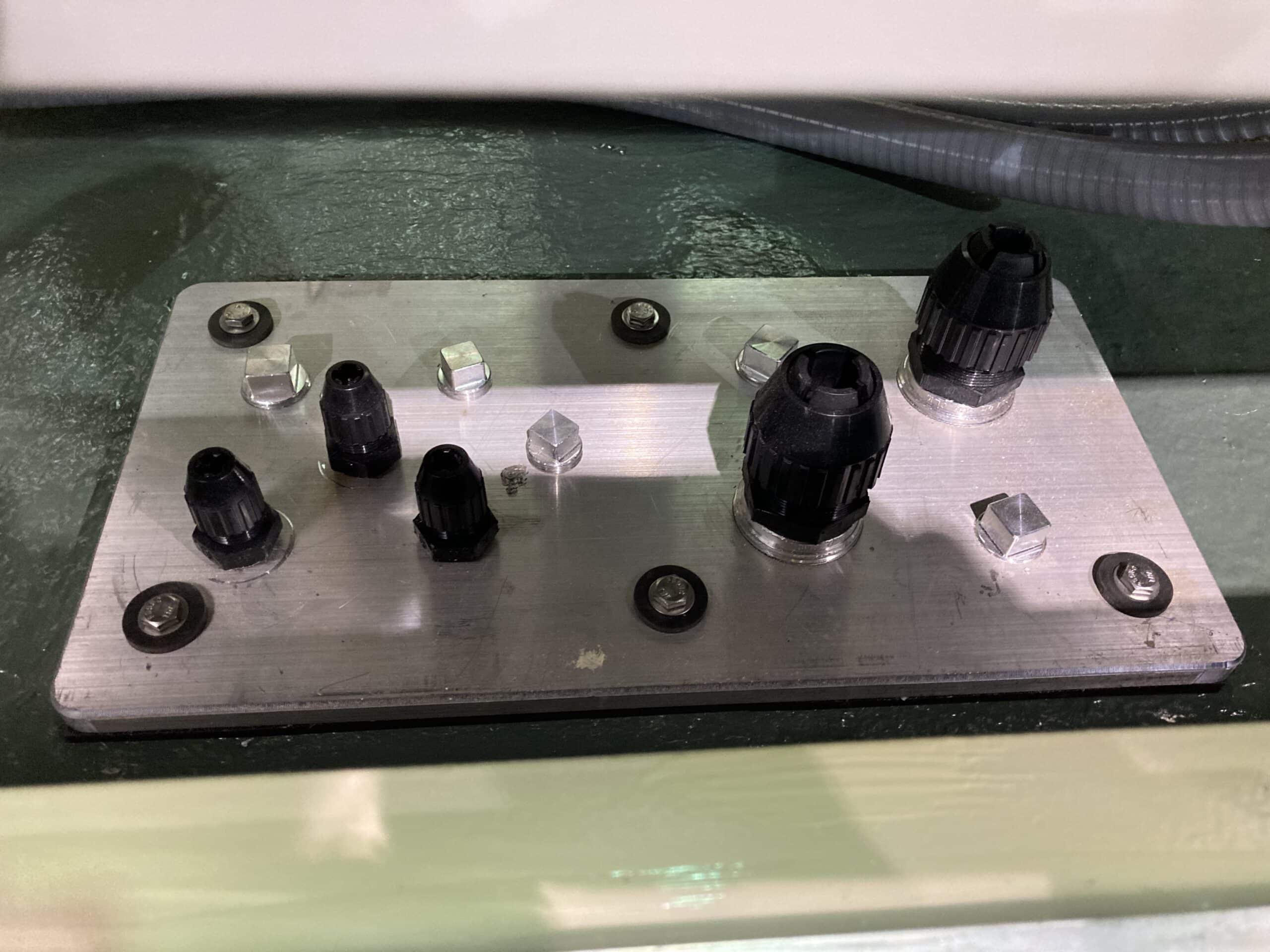 1/2″ thick aluminum connection plate sealed and gasketed with chord grips and seal tights