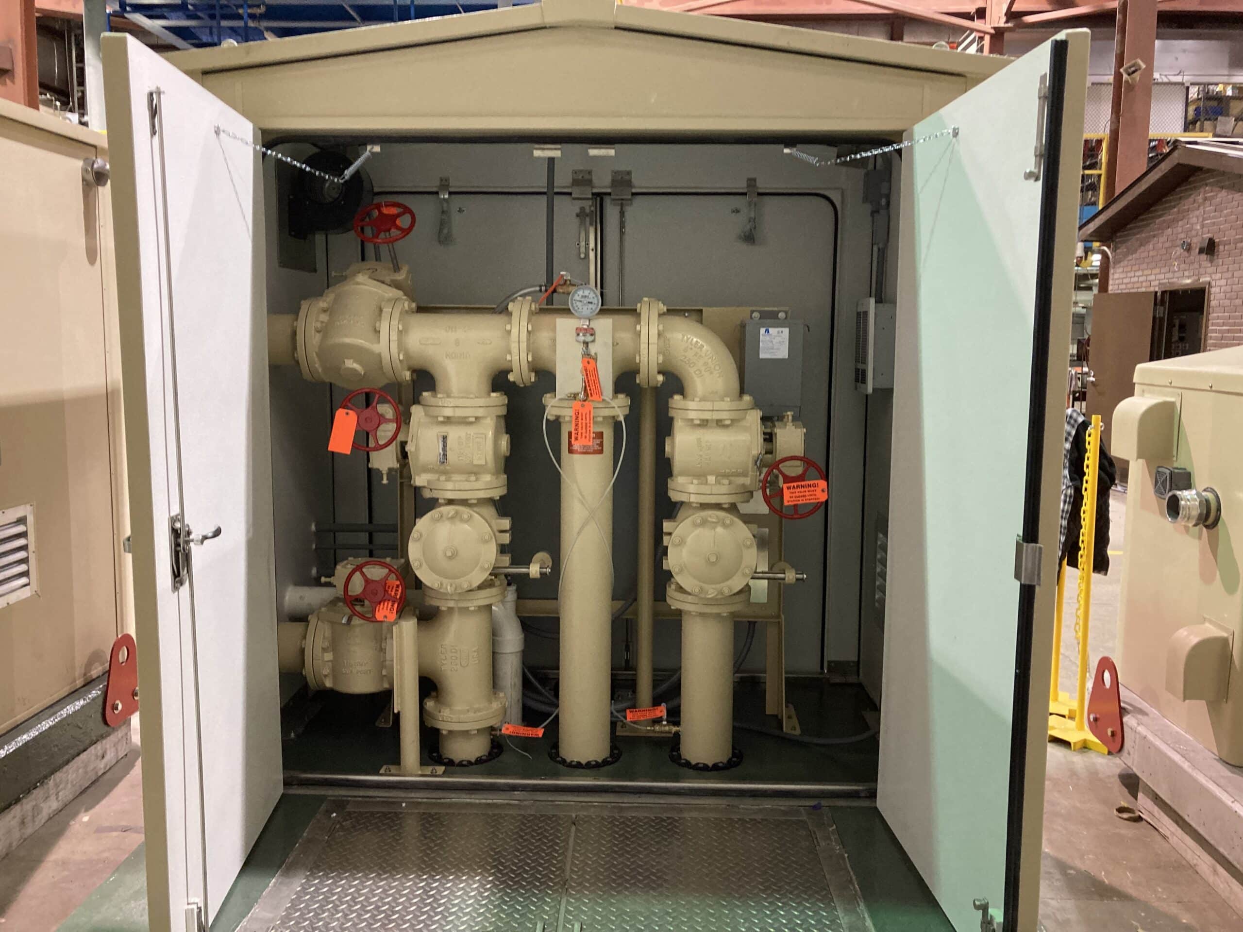 Access to valves & piping Tall PumpMate with open doors showing the piping and valves.