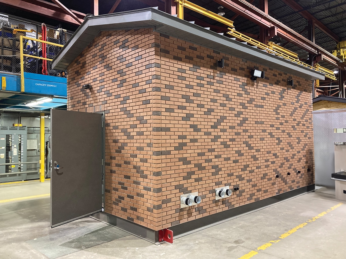 Exterior picture of Power Shack building. Shows red/brown brick siding.